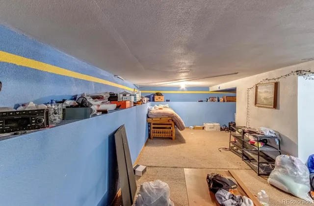 an aerial view of residential houses and car parked on street side