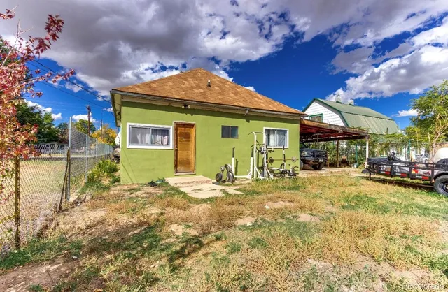 a front view of a house with garden and porch