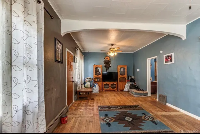 a living room with furniture and a rug