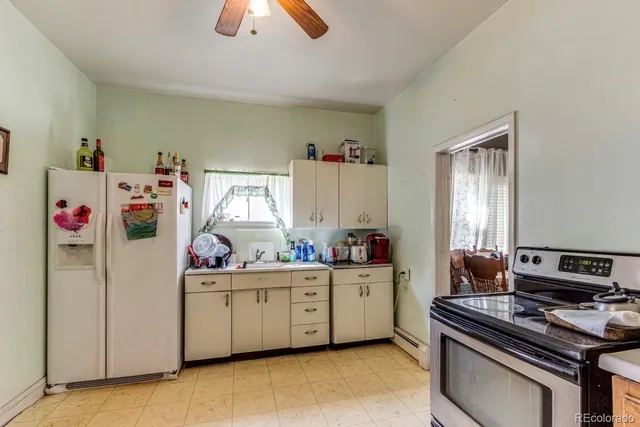 a kitchen that has a sink and a stove