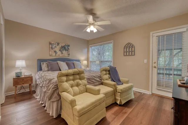 a bedroom with a large bed and a tv