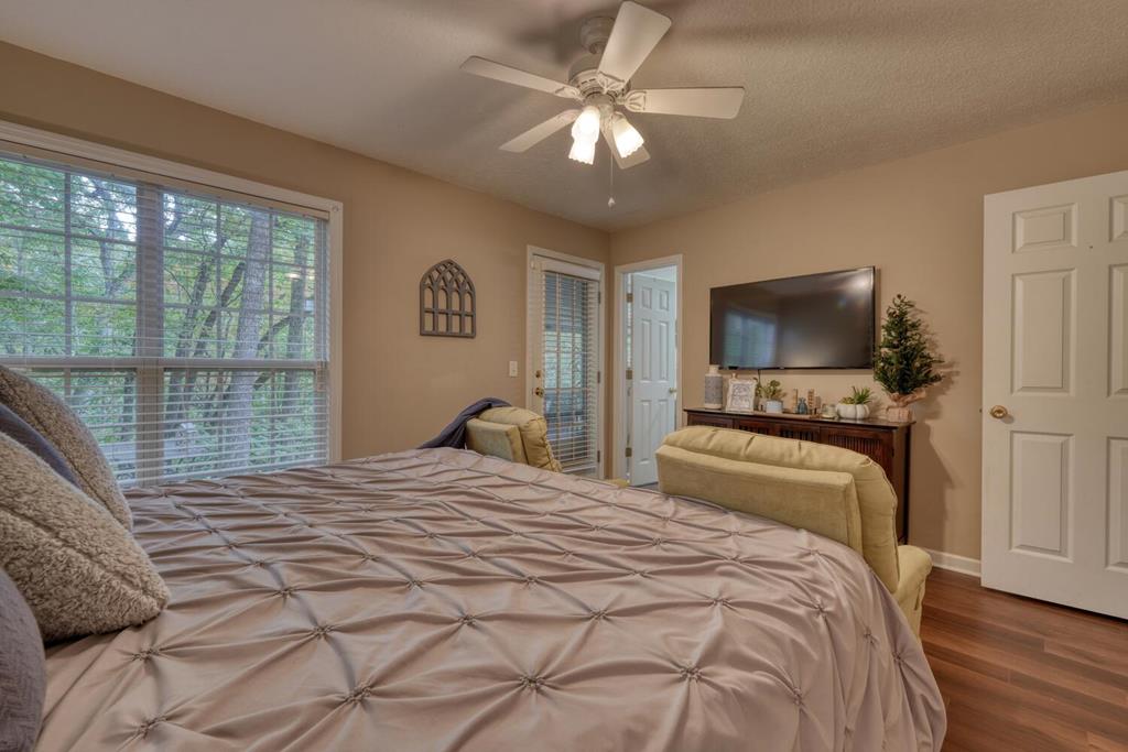 2532 Hunter Road Hiawassee, GA 30546 - Photo 19 of 54 a bedroom with a large bed and a tv