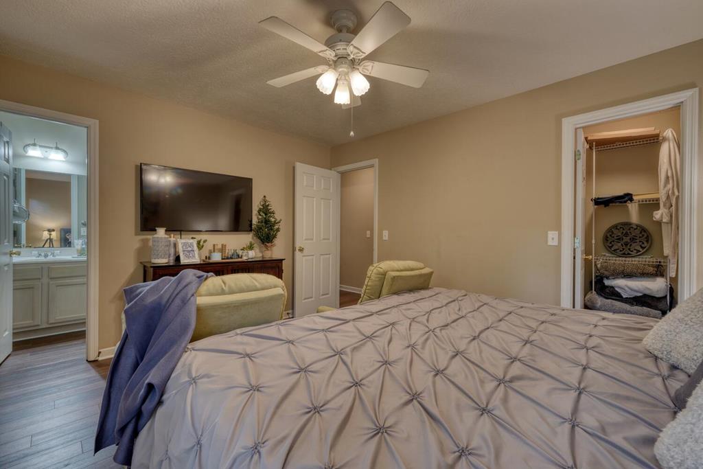 2532 Hunter Road Hiawassee, GA 30546 - Photo 20 of 54 a bedroom with a bed and a flat tv screen on dresser