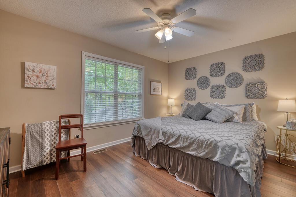 2532 Hunter Road Hiawassee, GA 30546 - Photo 22 of 54 a bedroom with a large bed and a window