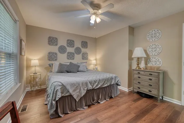 a bedroom with furniture and flat screen tv