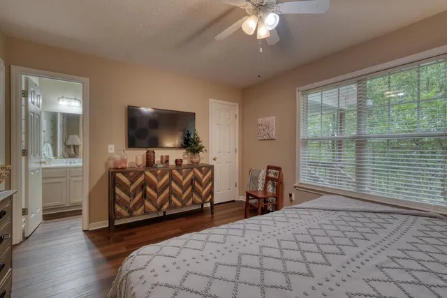 a bathroom with a toilet a sink and a mirror