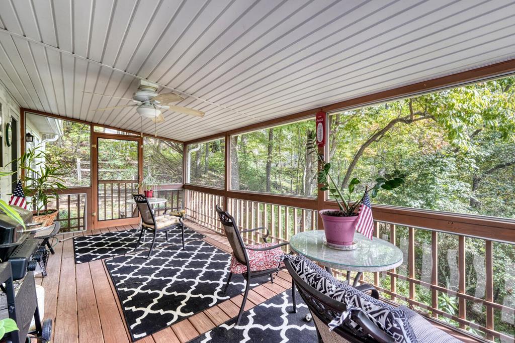 2532 Hunter Road Hiawassee, GA 30546 - Photo 33 of 54 a living room with furniture and a floor to ceiling window