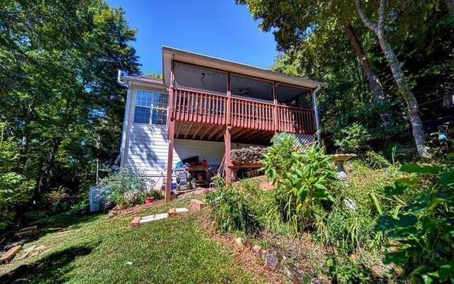 a view of a house with wooden deck
