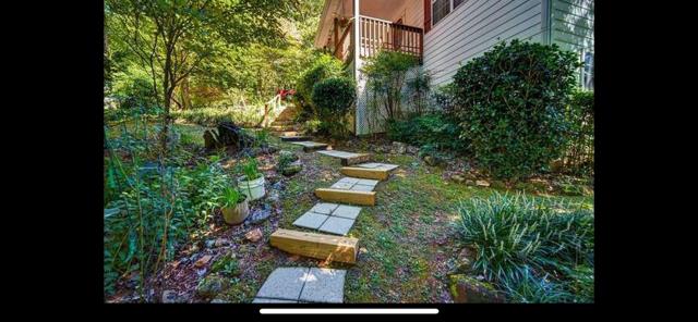 2532 Hunter Road Hiawassee, GA 30546 - Photo 42 of 54 a view of a yard with plants and large trees