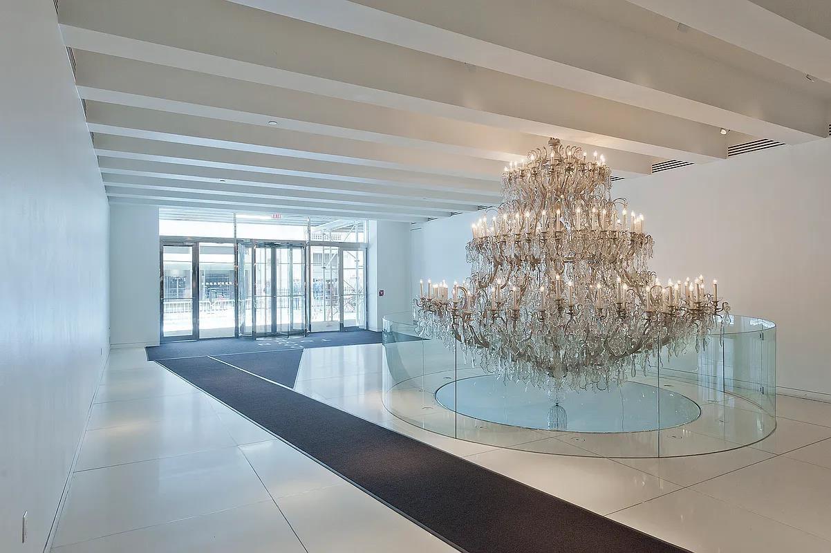 15 Broad Street, Unit 2828 Manhattan, NY 10005 - Photo 11 of 14 a view of a chandelier in a room