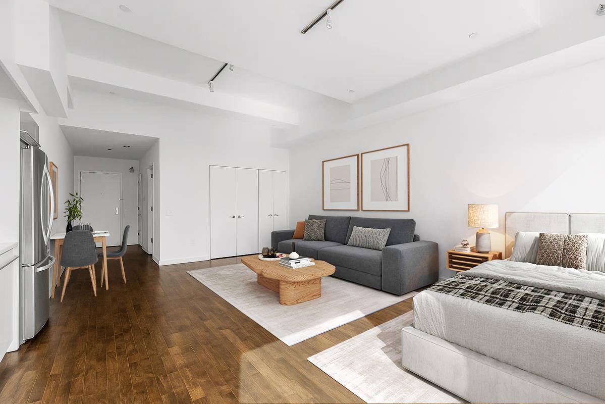 15 Broad Street, Unit 2828 Manhattan, NY 10005 - Photo 2 of 14 a living room with furniture and wooden floor