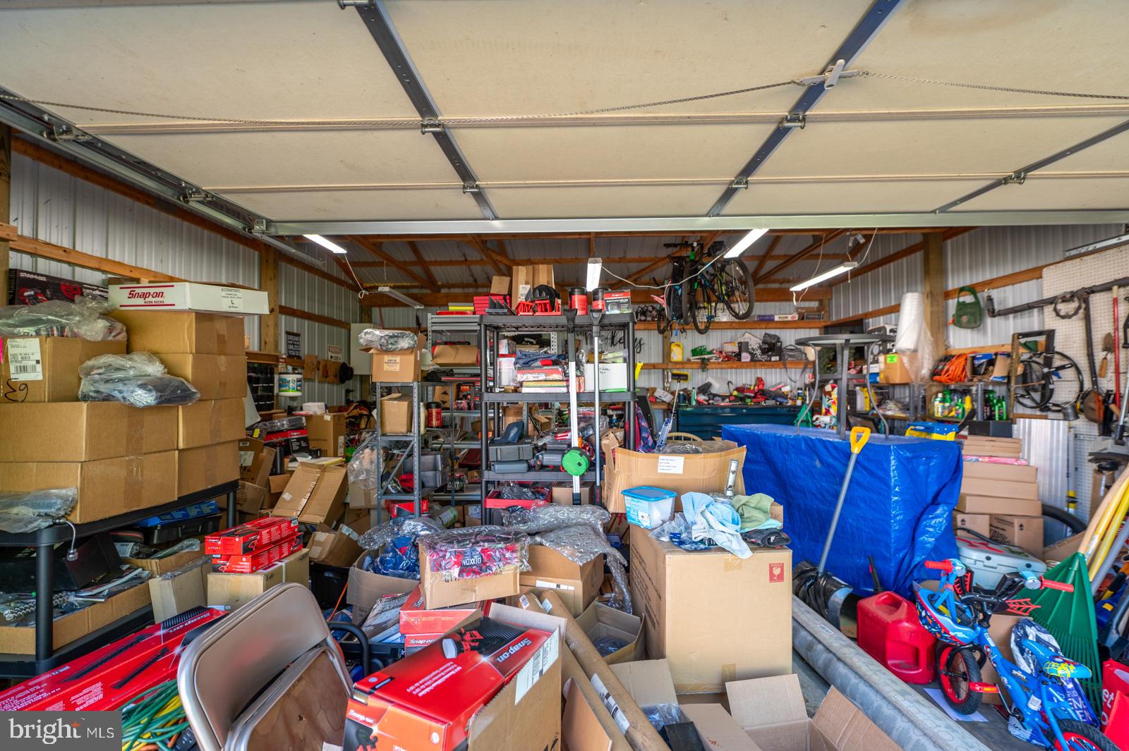 182 Rose Valley Road Pottstown, PA 19464 - Photo 19 of 52 Cluttered garage brimming with tools.
