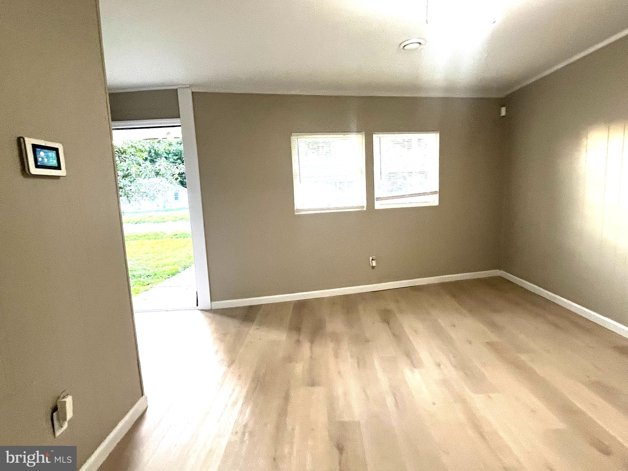 219 Kinsley Road Pemberton, NJ 08068 - Photo 3 of 22 a view of an empty room and a window