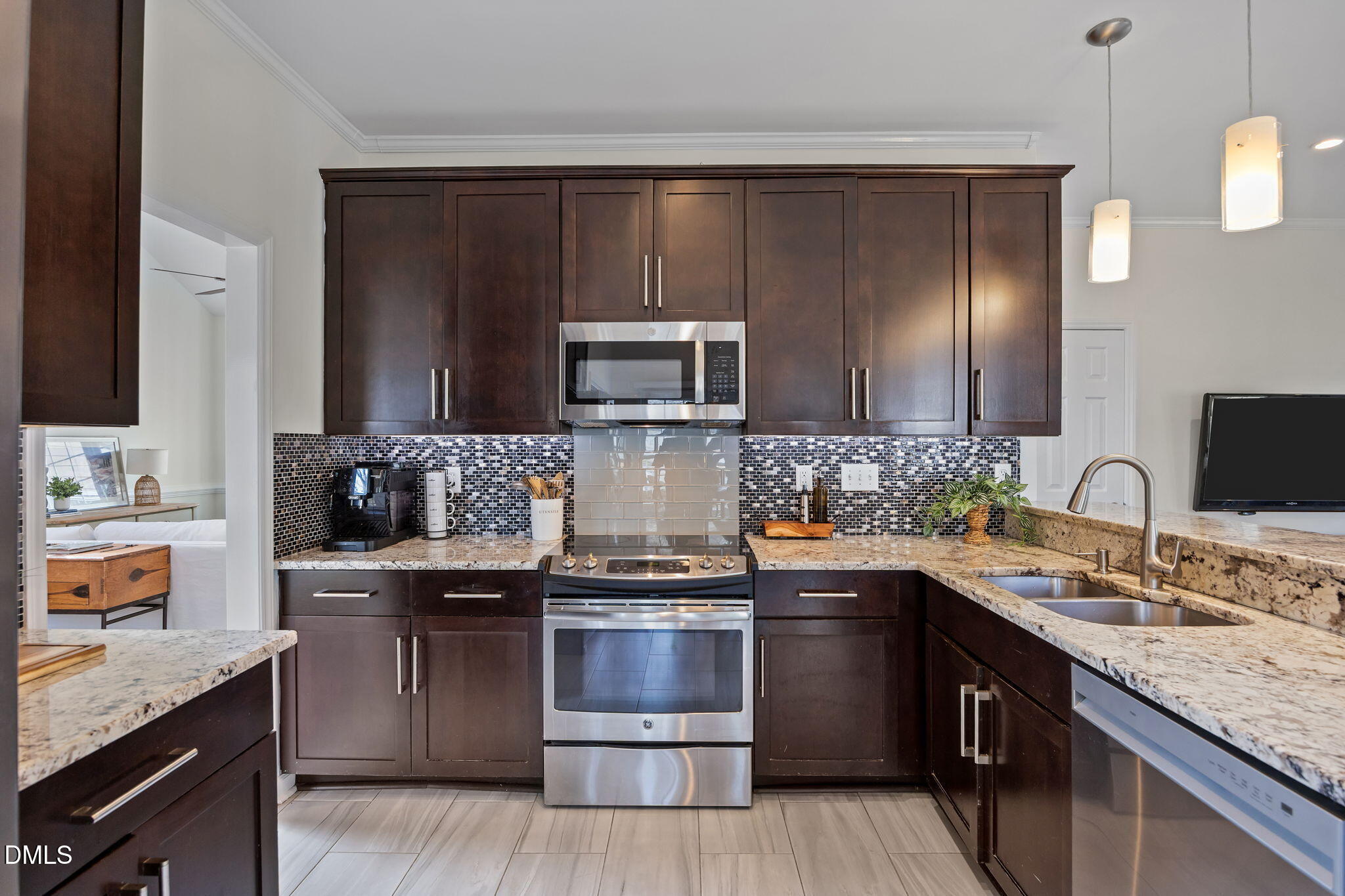 5512 Banwell Place Raleigh, NC 27613 - Photo 11 of 47 a kitchen with a sink and steel appliances