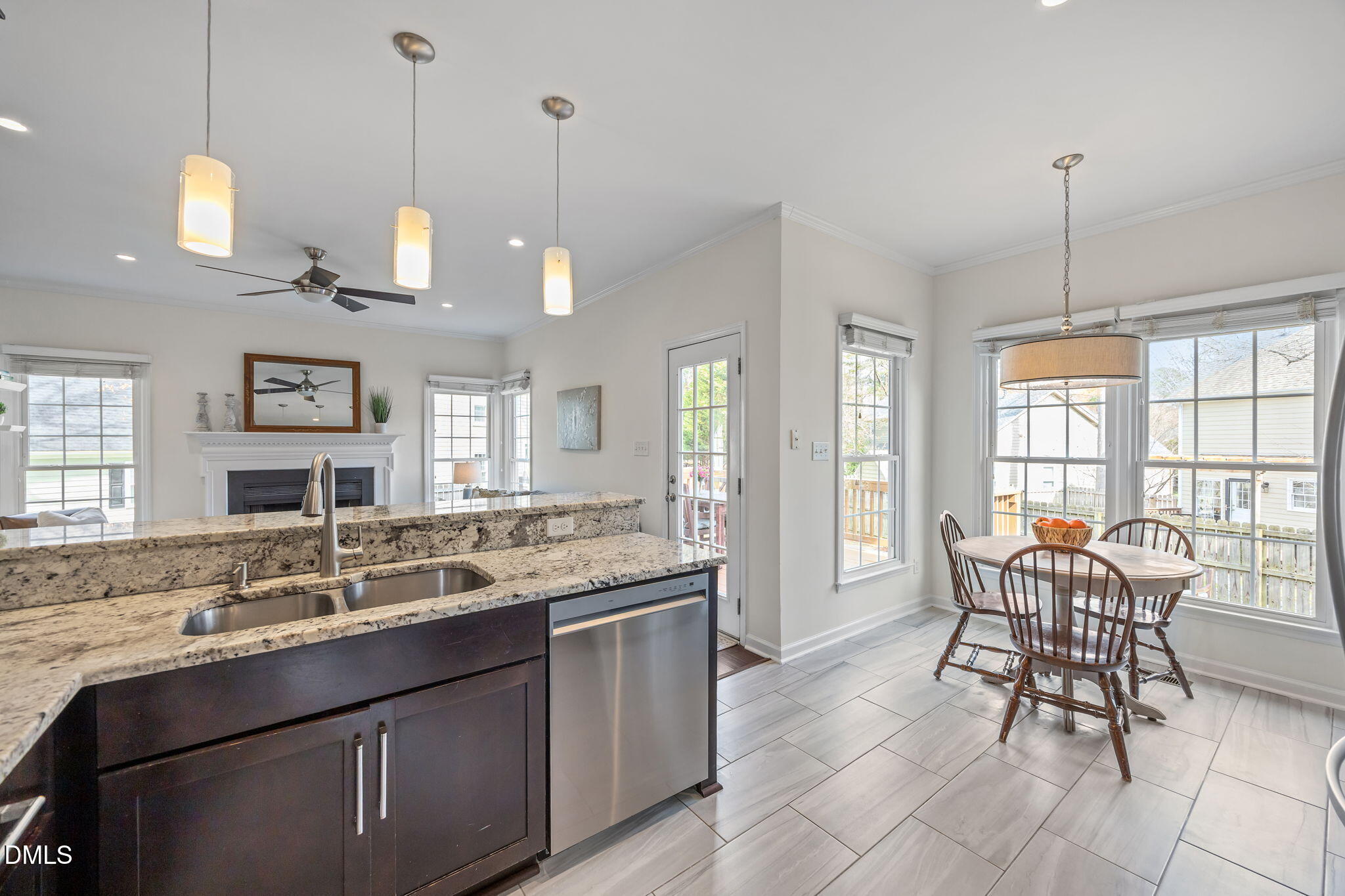 5512 Banwell Place Raleigh, NC 27613 - Photo 14 of 47 a view of a kitchen counter space dining table and chairs