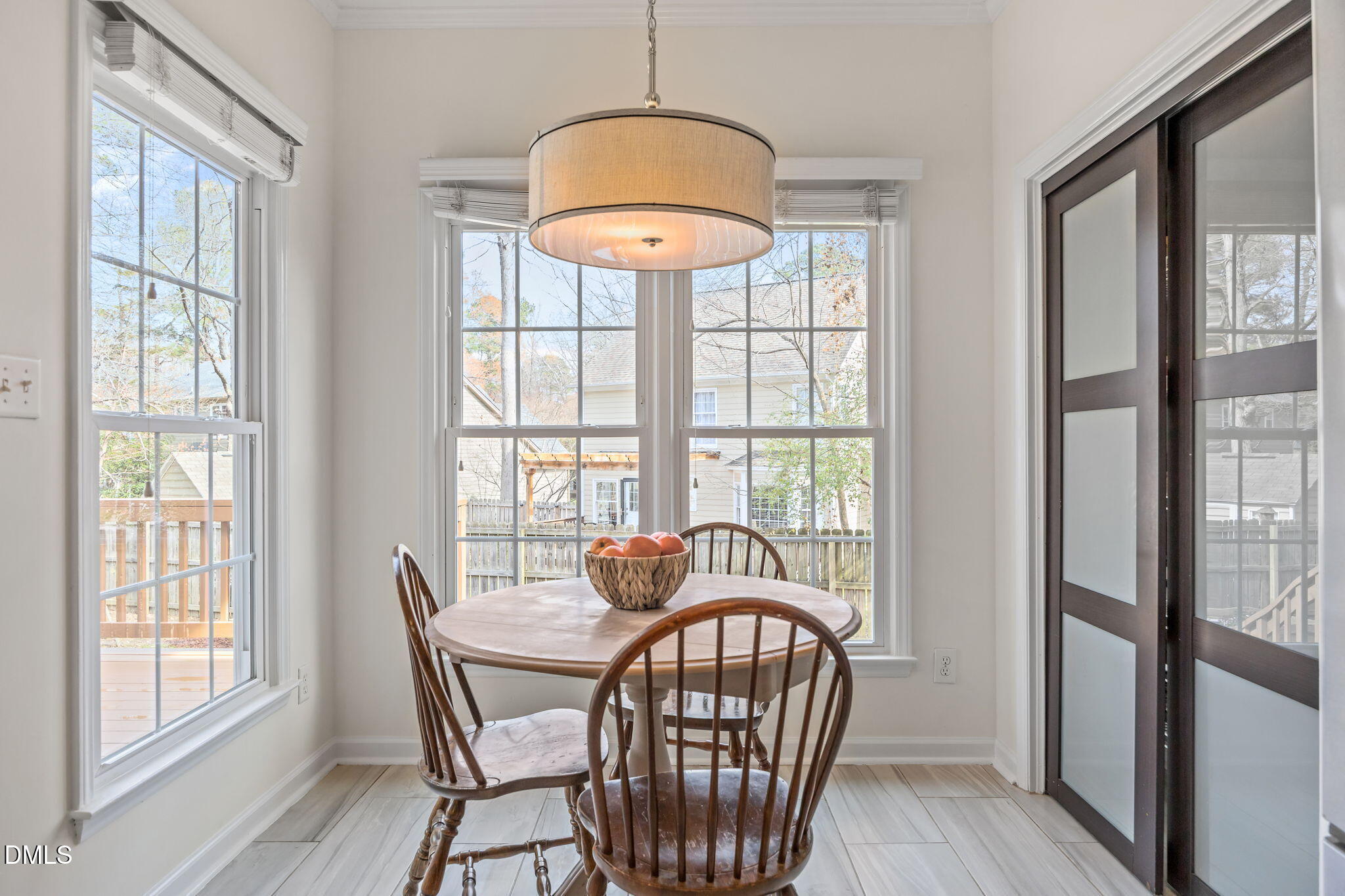 5512 Banwell Place Raleigh, NC 27613 - Photo 15 of 47 a dining room with furniture window and wooden floor