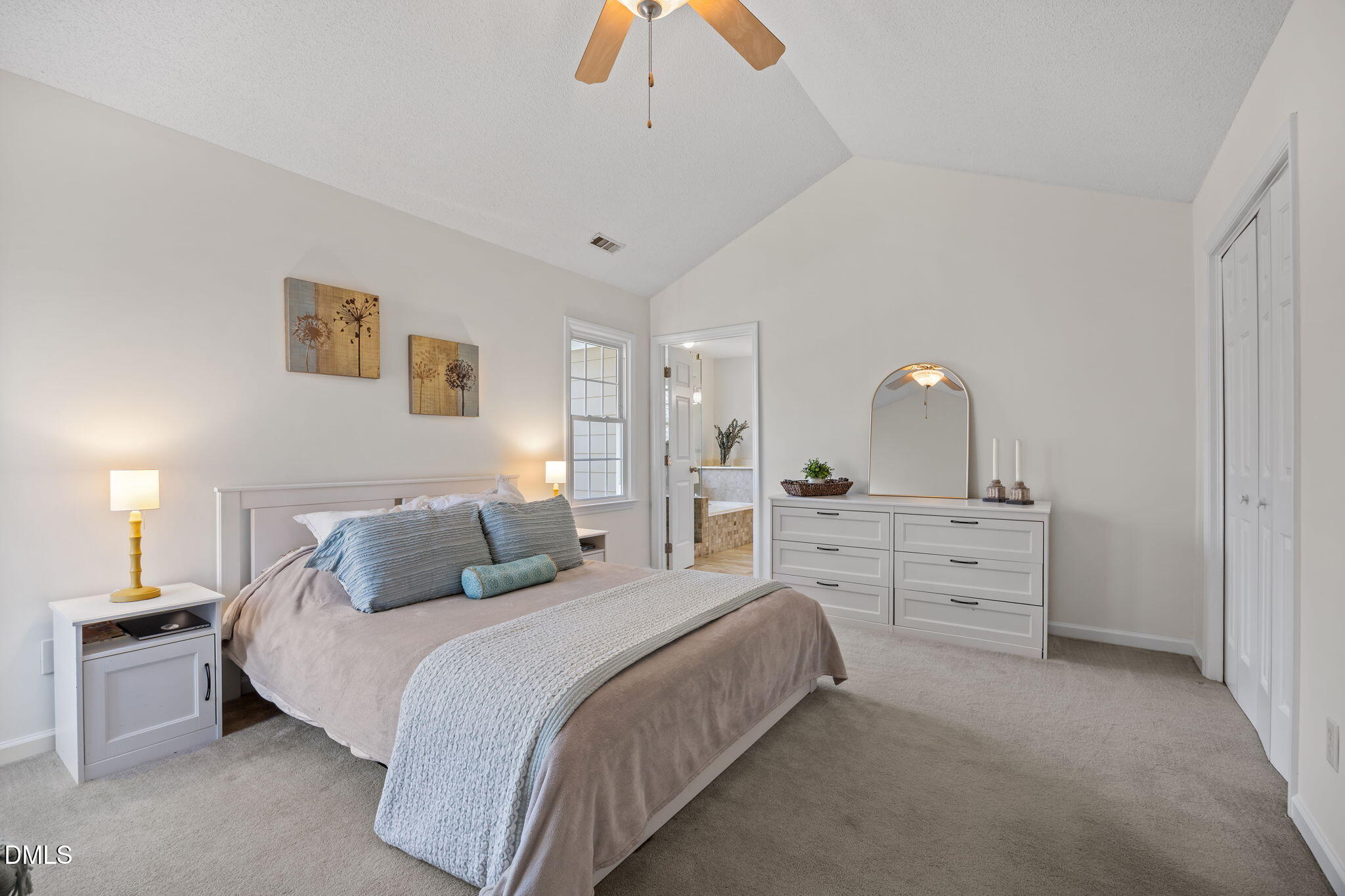 5512 Banwell Place Raleigh, NC 27613 - Photo 23 of 47 a bedroom with a bed and a dresser