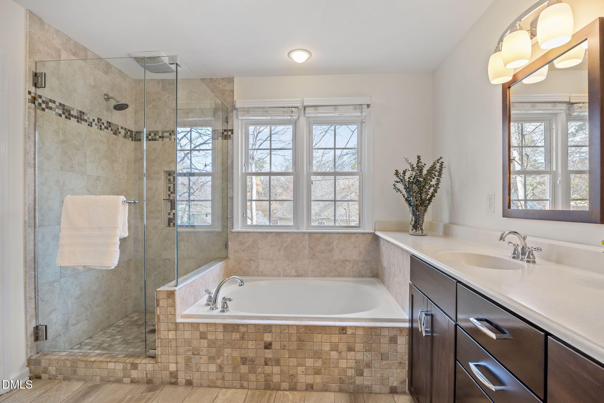 5512 Banwell Place Raleigh, NC 27613 - Photo 27 of 47 a spacious bathroom with a large tub shower and sink