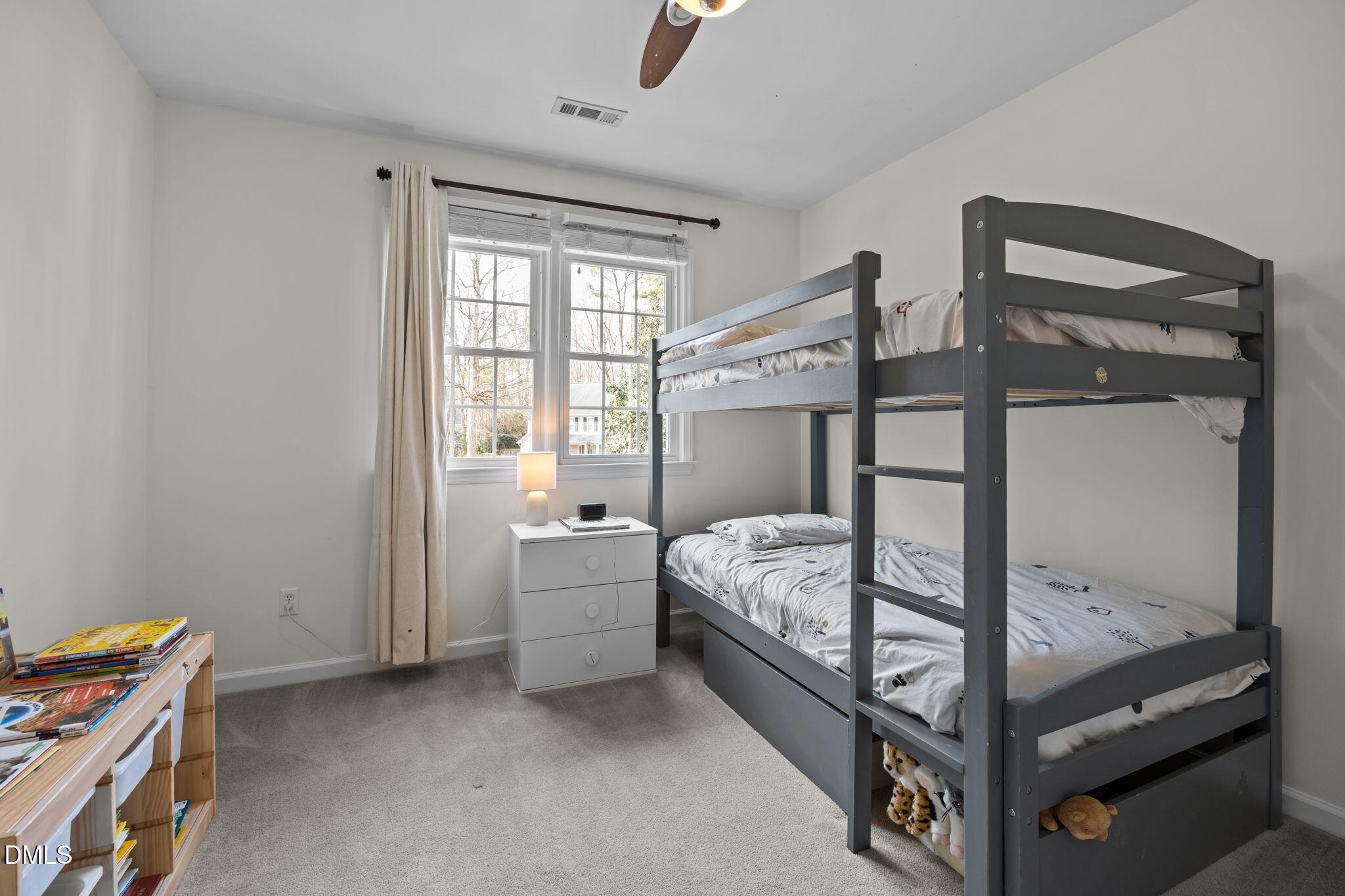 5512 Banwell Place Raleigh, NC 27613 - Photo 30 of 47 a bed room with a bed and a window