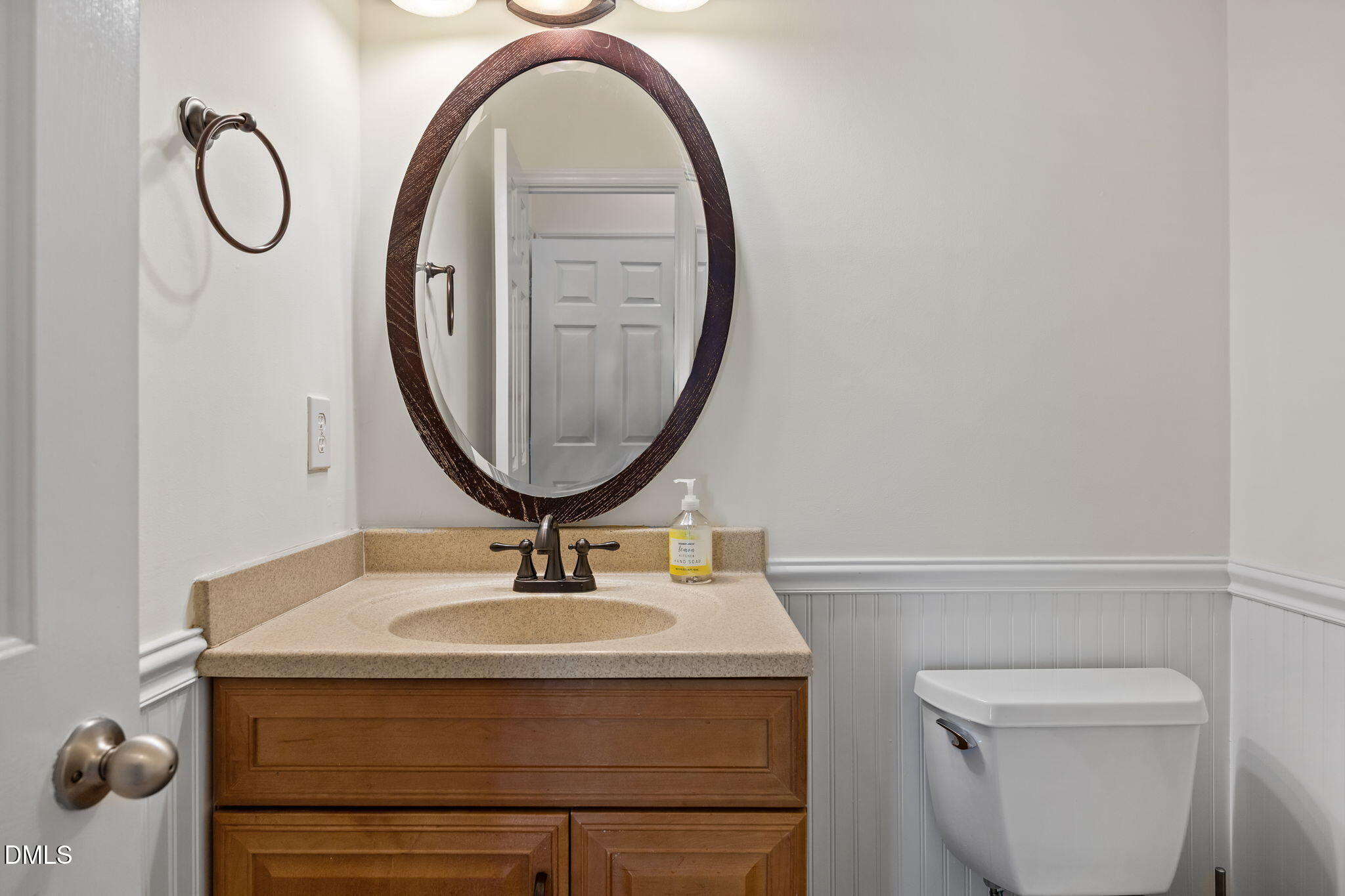 5512 Banwell Place Raleigh, NC 27613 - Photo 32 of 47 a bathroom with a sink a mirror and a toilet