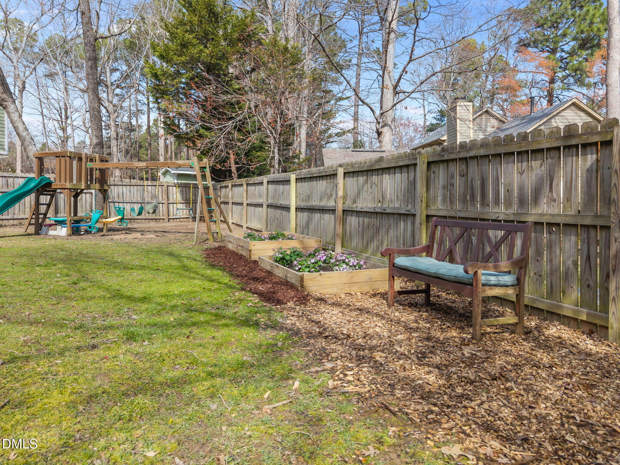5512 Banwell Place Raleigh, NC 27613 - Photo 38 of 47 a view of a chairs setting in the backyard
