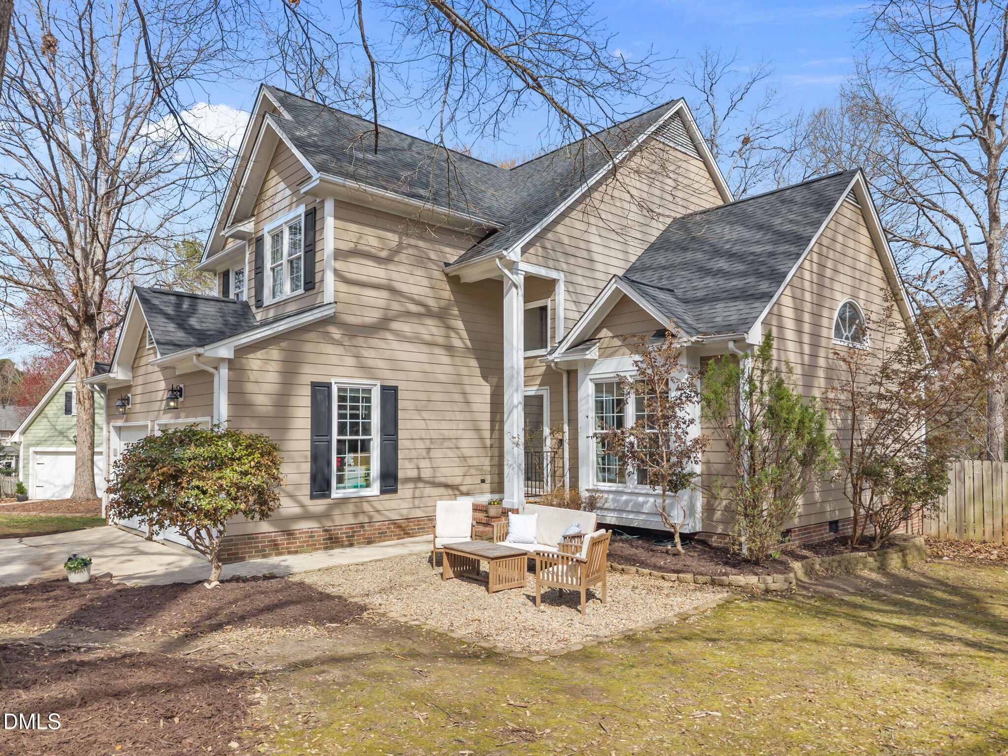 5512 Banwell Place Raleigh, NC 27613 - Photo 3 of 47 a view of a house with backyard chairs and wooden fence