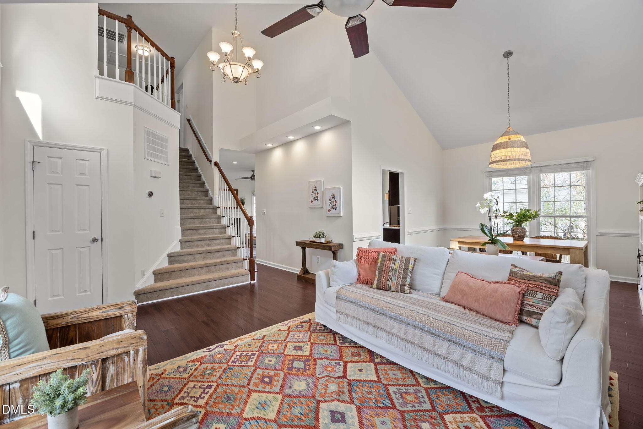 5512 Banwell Place Raleigh, NC 27613 - Photo 7 of 47 a living room with furniture and a chandelier