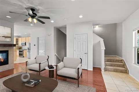a living room with furniture and a fireplace