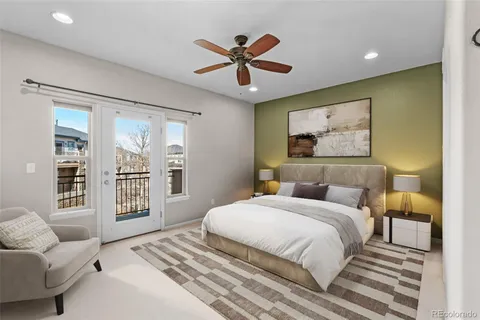 a bedroom with a bed and ceiling fan
