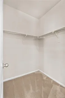 a view of an empty walk in closet