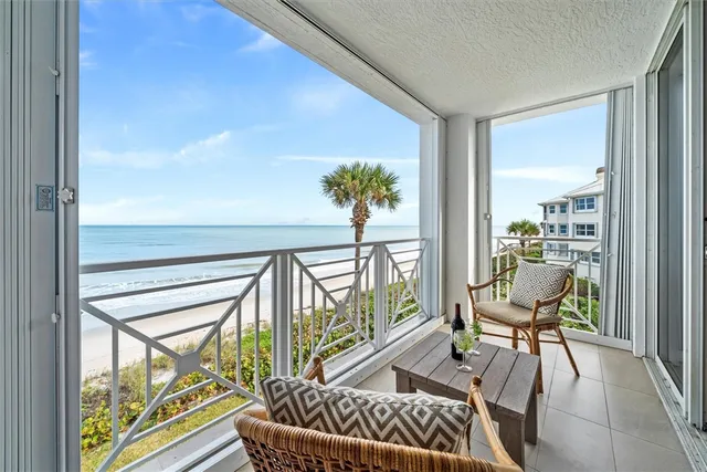 a view of balcony with furniture