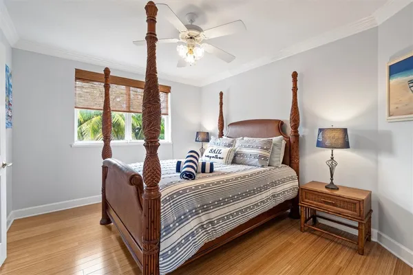 a bed room with a bed and a chandelier