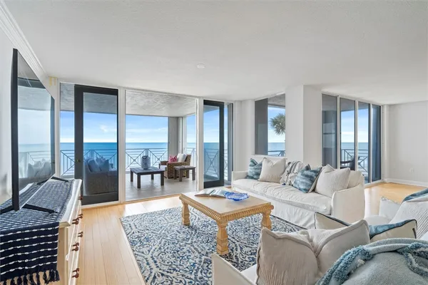 a living room with furniture and a table