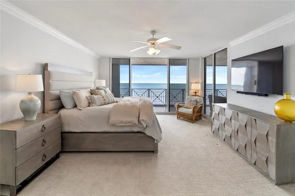 a spacious bedroom with bed and a large window