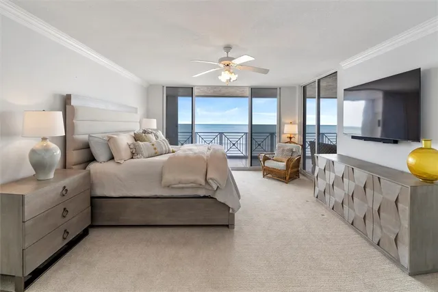 a spacious bedroom with bed and a large window