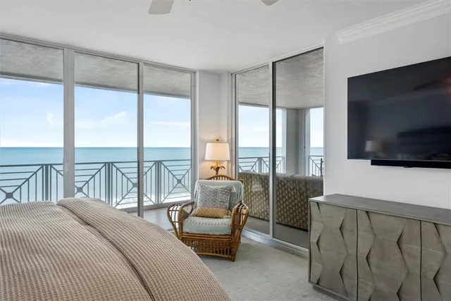 a bedroom with furniture and a flat screen tv