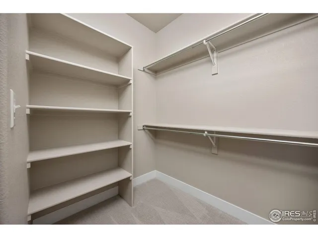 a view of an empty walk in closet