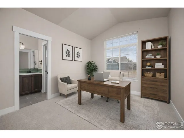 a living room with furniture a table and decor