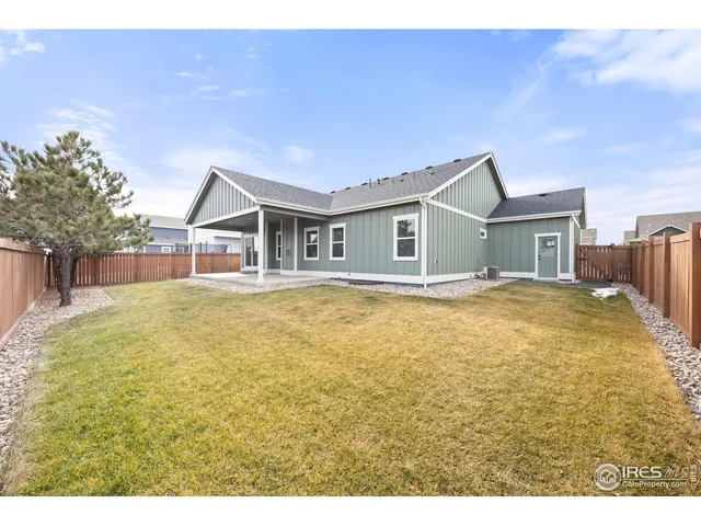 a house with swimming pool in front of it