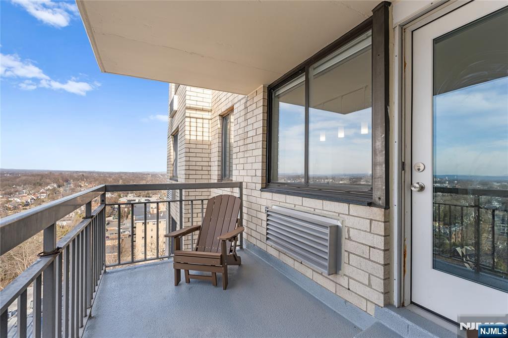 307 Prospect Avenue, Unit 17D Hackensack, NJ 07601 - Photo 12 of 29 a view of two chairs in the balcony