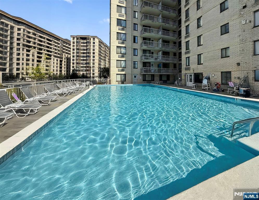 307 Prospect Avenue, Unit 17D Hackensack, NJ 07601 - Photo 15 of 29 a view of building with yard