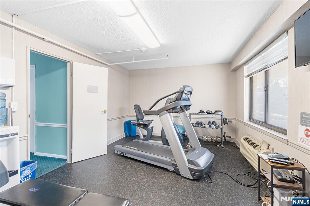 307 Prospect Avenue, Unit 17D Hackensack, NJ 07601 - Photo 21 of 29 a view of a room with gym equipment