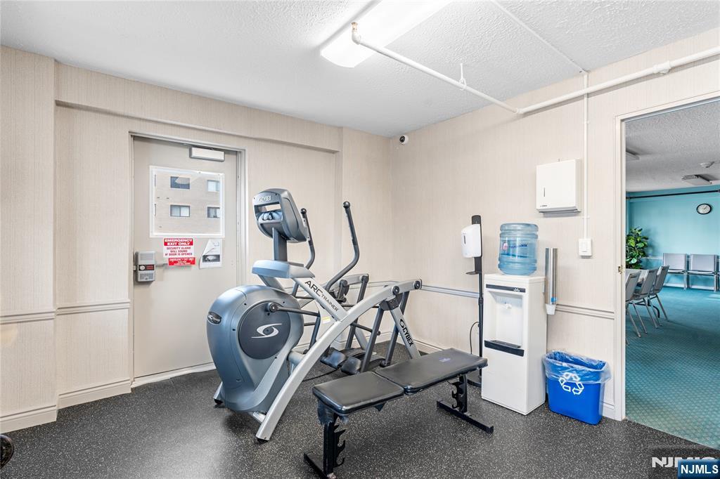 307 Prospect Avenue, Unit 17D Hackensack, NJ 07601 - Photo 22 of 29 a view of a room with gym equipment