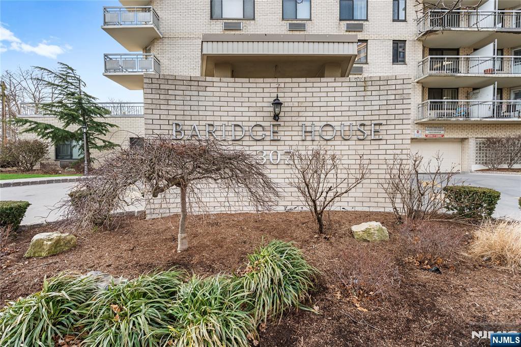 307 Prospect Avenue, Unit 17D Hackensack, NJ 07601 - Photo 27 of 29 a view of a house with a yard