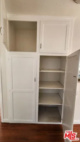 a close view of a sink and cabinets