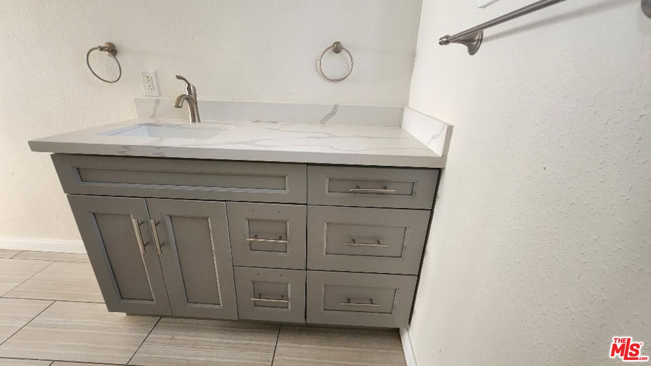 251 West 41st Place Los Angeles, CA 90037 - Photo 15 of 18 a close view of a sink and cabinets