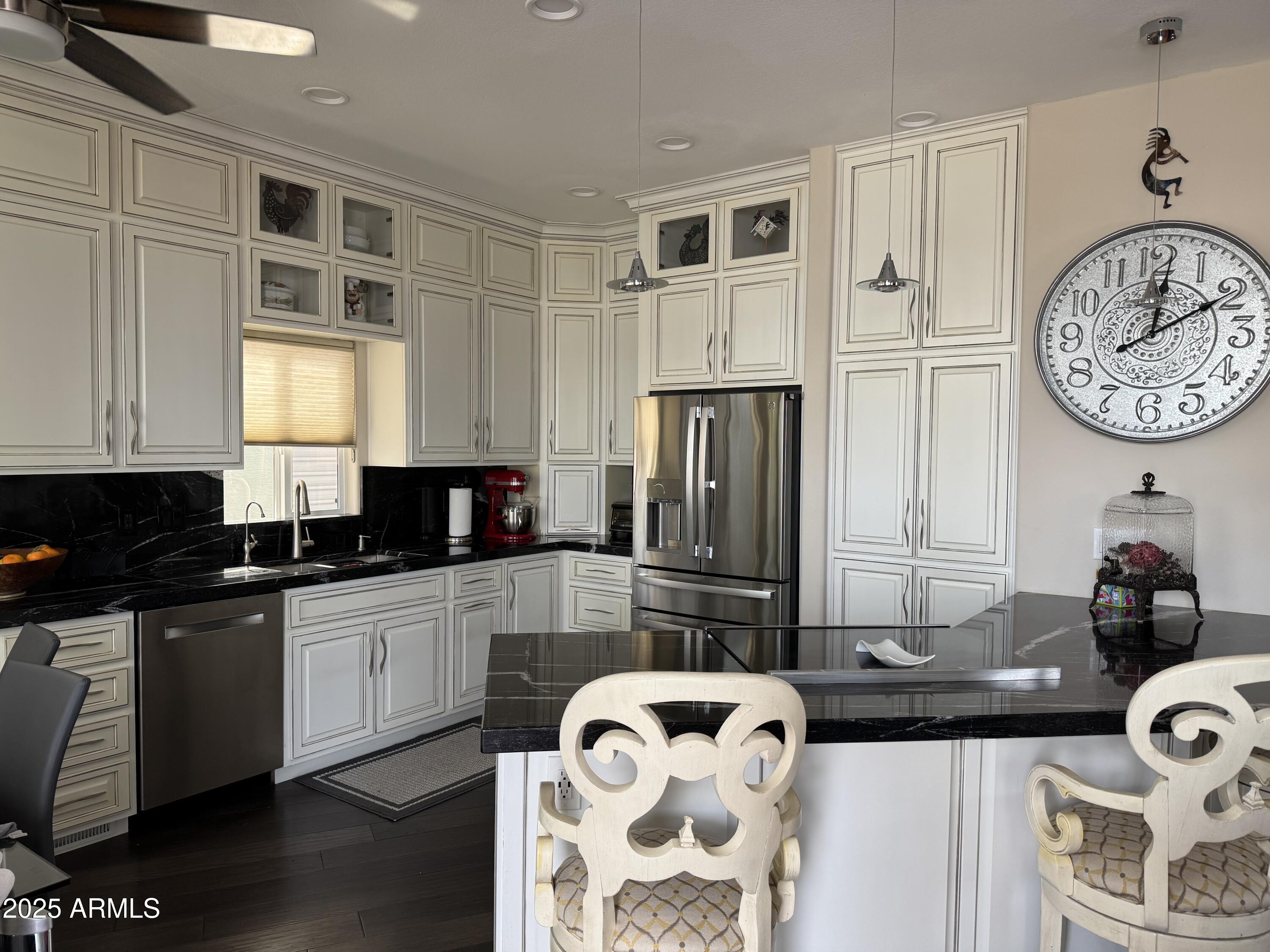 1279 South Sioux Drive Apache Junction, AZ 85119 - Photo 11 of 34 a kitchen with stainless steel appliances granite countertop a stove and a sink