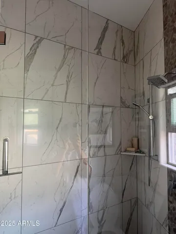 a bathroom with a sink toilet and mirror