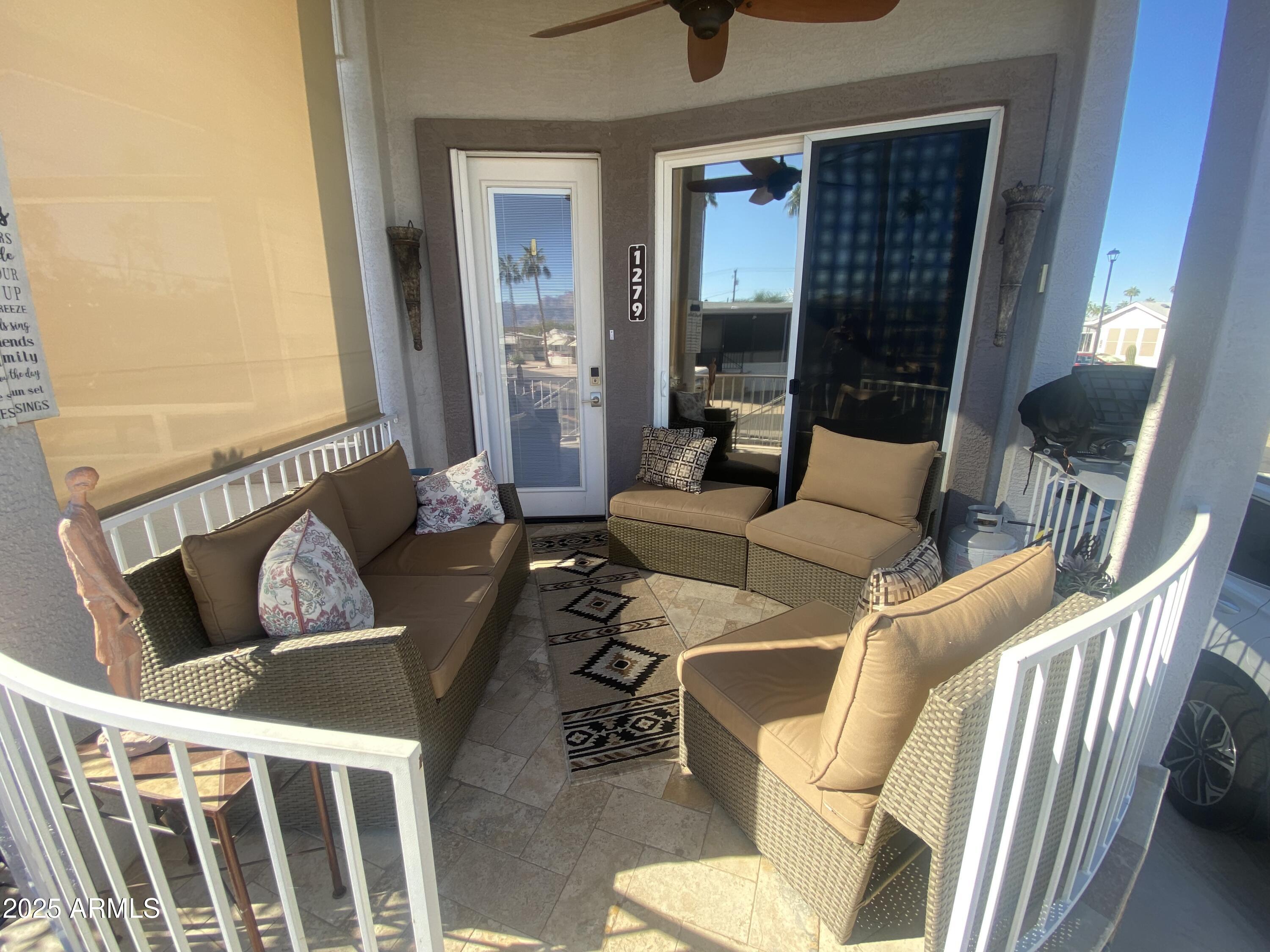 1279 South Sioux Drive Apache Junction, AZ 85119 - Photo 2 of 34 a living room with furniture and a window