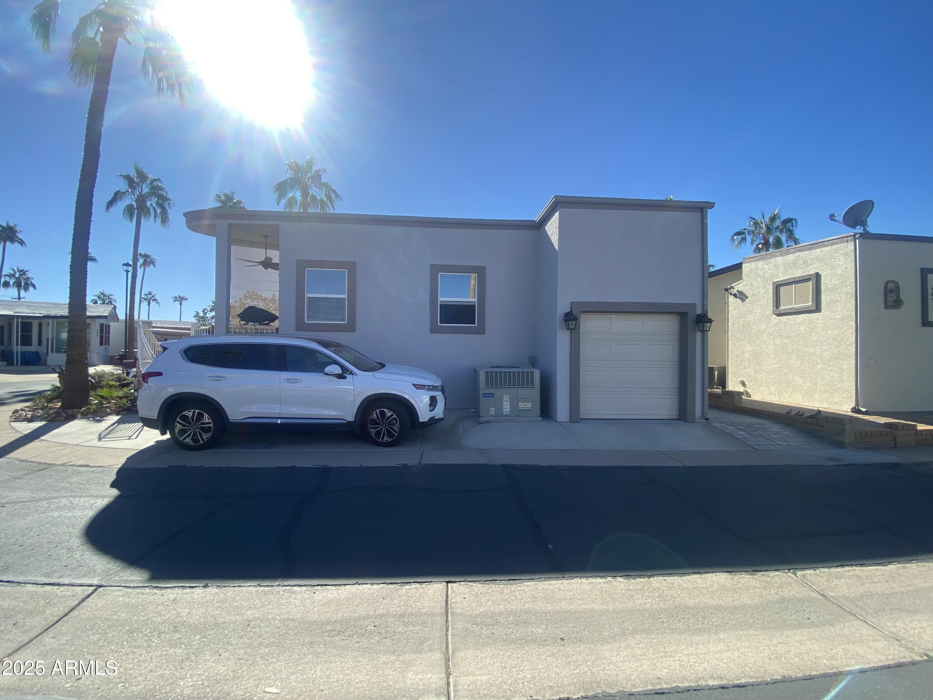 1279 South Sioux Drive Apache Junction, AZ 85119 - Photo 26 of 34 a view of a car parked in front of a house